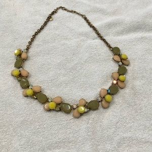 J. Crew statement necklace with sage green, yellow, pink and iridescent gems.
